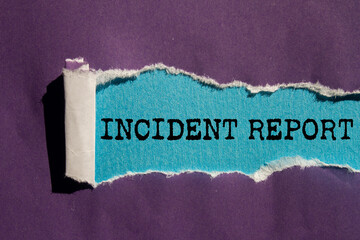 Incident report message written on ripped torn purple paper on blue background. Conceptual incident...