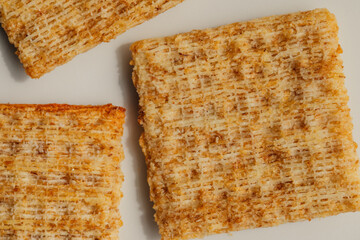 wheat crackers on a white plate	