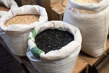 Beans for sale at a stand. Legume seed rich in nutrients such as proteins, fibers, vitamins,...