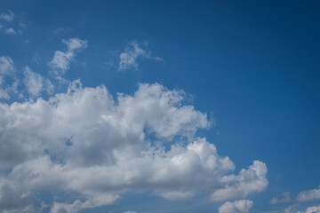 white cumulus clouds in blue sky
