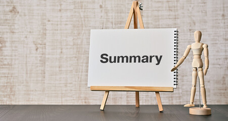 There is notebook with the word Summary. It is as an eye-catching image.