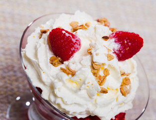 Traditional sweet dish in Scottish cuisine - Cranahan served in glass dessert bowl with fresh raspberries