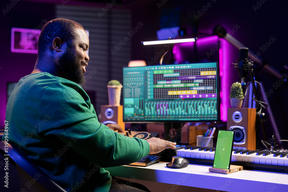 Aufkleber composer musician mixing his tracks in pc software with an isolated smartphone screen, working on la