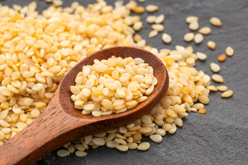 Sesamum indicum - Raw organic sesame seeds in a spoon
