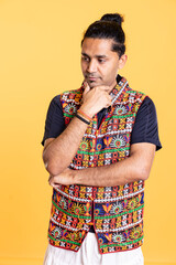 Pensive man caught in brainstorming process, trying to come up with ideas, isolated over studio background. Conflicted person doing stroking chin gesture, debating, studio backdrop