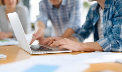 Business team in office focused on hands pointing at laptop screen. Generative AI