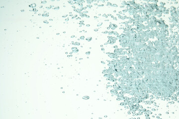 Many water bubbles on light background, closeup