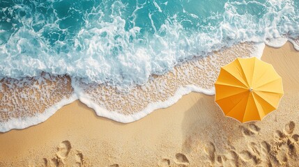 Naklejka premium Bright Yellow Umbrella Above Turquoise Waves on Sandy Beach Shoreline