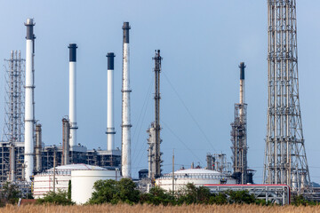 Oil and gas refinery industrial factory plant with blue sky background at oil and gas refinery zone, Business oil and gas industrial plant, Oil and gas refinery petrochemical plant industrial.