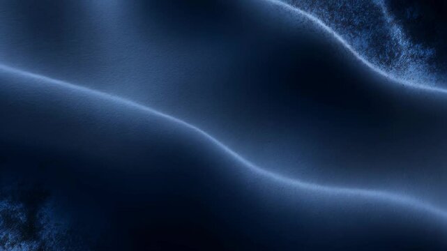 Close-up of a navy blue matte suede backdrop with a velvet leather surface.