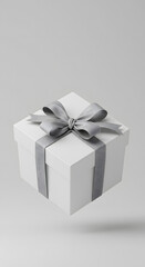 Square white gift box with a silver ribbon floating on a light grey background.
