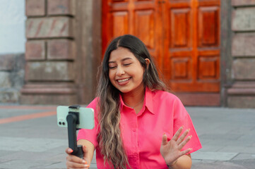 A Cheerful Young Woman Vlogging in a Beautiful Historic Setting with Great Enthusiasm