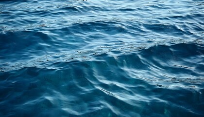 Obraz premium A tranquil close-up of calm sea water with gentle waves rippling across the surface. 