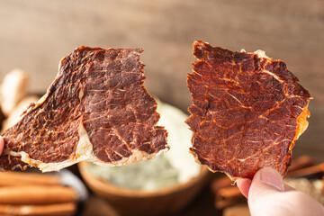 Dried beef crisps, beef crisps on a wooden background