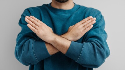 Man Making a Stop or No Gesture with Crossed Arms
