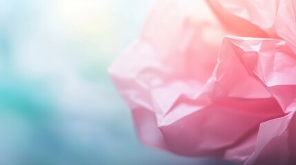 Soft crumpled pink paper forms an abstract focal point, blending with light colors for a tranquil atmosphere