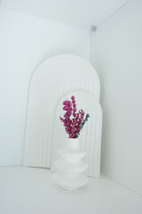 Modern decor featuring pink flowers in a minimalist setting
