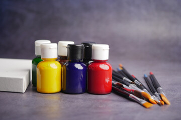 Vibrant paints and brushes ready for an artistic project