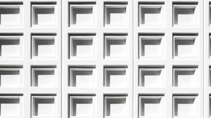 Abstract white wall texture featuring geometric patterns and shadows, suitable for modern design use