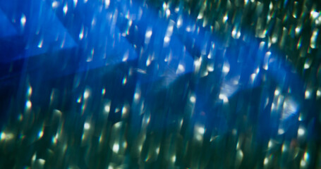 Multicolor kaleidoscope. Defocused effect brilliant. Blinking blue particles lens flare turning on...