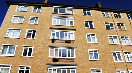 Fototapeta premium Multi-story residential building with many windows