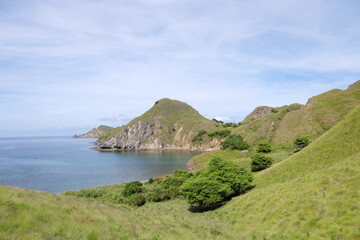 A breathtaking view of Labuan Bajo with turquoise waters, green islands, and vibrant coastal charm...