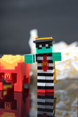 Fototapeta premium Bangkok, Thailand - April 8, 2025 : Zombie hamburglar and Minecraft fries helmet, Minecraft blind box from McDonald's collaborates