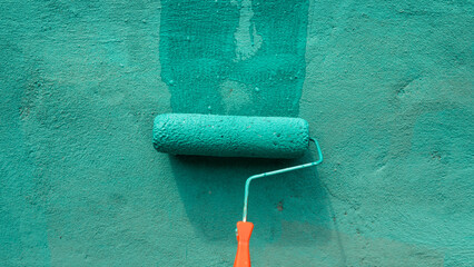 Roller Brush Painting,Paint the fence wall in summer bright blue.