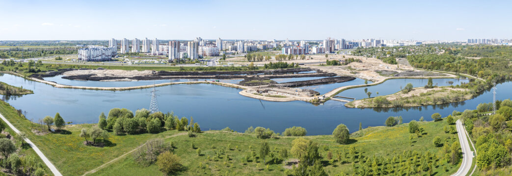 land improvement and reclamation. drainage of swampy area in suburb neighborhood of city. panoramic aerial view.
