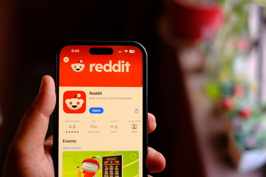 Delhi, India April 11 2025 : reddit app on smartphone, a platform for sharing content, engaging in discussions, and connecting with communities with same interests.