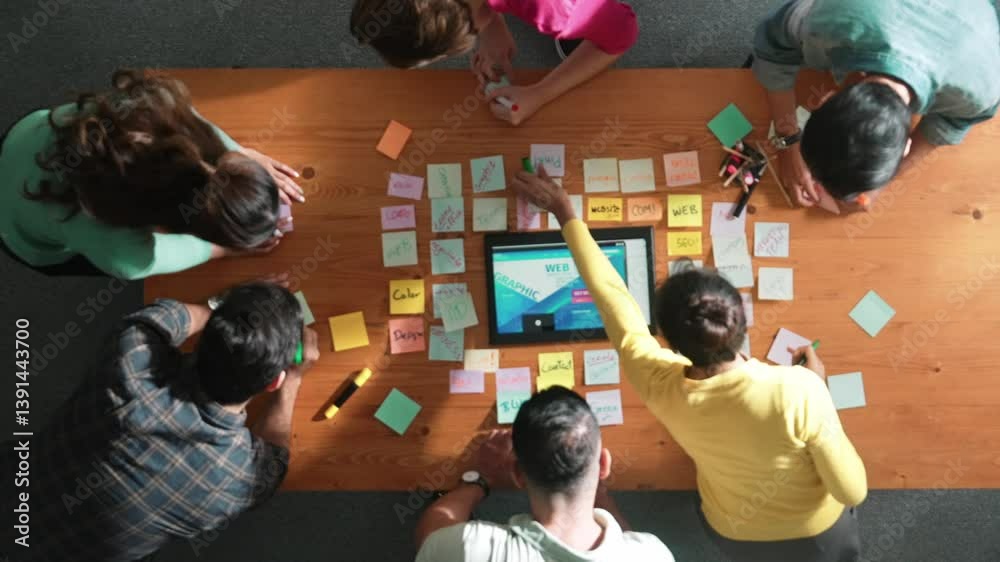 Poster time lapse of programmer brainstorming and planning about web design while looking at tablet wirefra