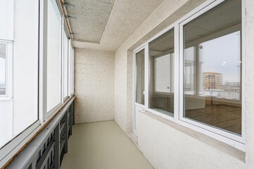 Fototapeta premium interior apartment room balcony overlooking the street, empty space without furniture