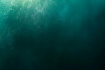 Fototapeta premium Underwater scene, dark teal water, light above.