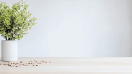 Fototapeta premium Simple, minimalist desk scene with a small potted plant and scattered wooden pieces