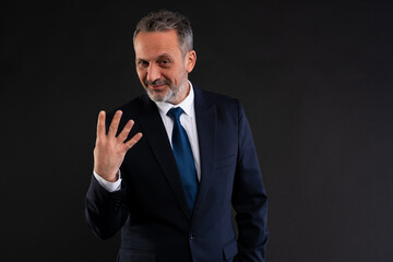 Businessman showing four fingers with a smirk.