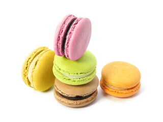 Pile of macaron cookies in various flavours and colours isolated on white background.