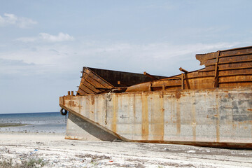 East Sumba, East Nusa Tenggara, Indonesia – 12. 22. 2018 – A cargo barge stranded in the...