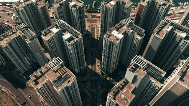 Aerial top down view of traffic and residential buildings in Busan, South Korea in the morning