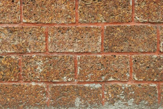 Old laterite stone bricks wall texture background
