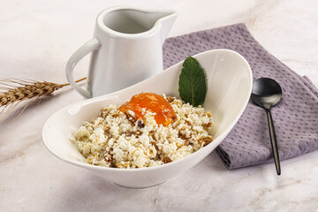 Curd with granola and orange jam