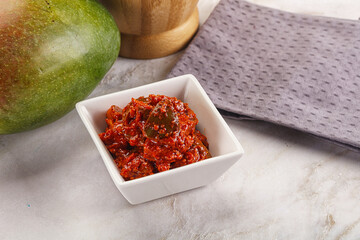 Spicy pickled raw green mango