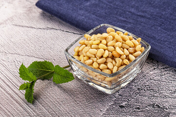 Peeled cedar nut in the bowl