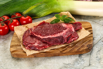 Raw beef cheeks cut for cooking