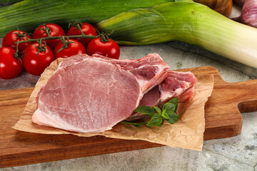 Raw pork steak loin with bone