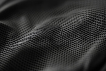 Soft black sports fabric texture with dotted pattern