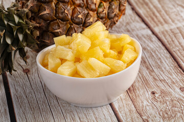 Sweet canned pineapple fruit pieces