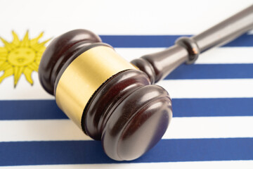 Uruguay for judge lawyer and US dollar banknotes on Ukraine flag, finance.