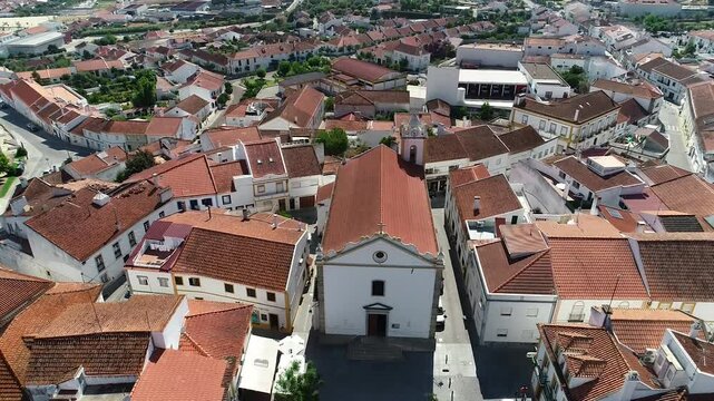 Drone footage showing Mora from an upview, starting close to the church. Located in Portugal.