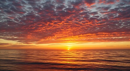 Fototapeta premium Sunset on red yellow sky back soft evening cloud over sea