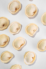 Dumplings with filling, frozen for cooking and frying